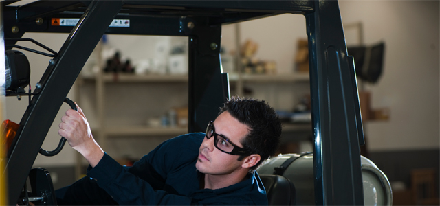 Fork lift truck driver wearing Willey X prescription industrial safety glasses